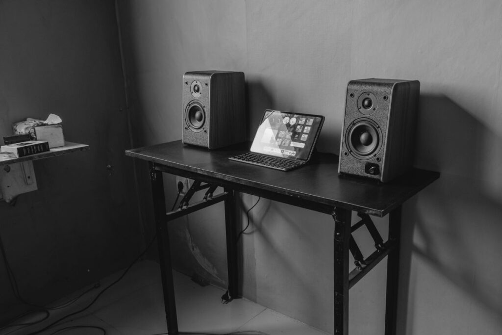 minimalist industrial folding desk with black metal collapsible cross legs and tablet setup